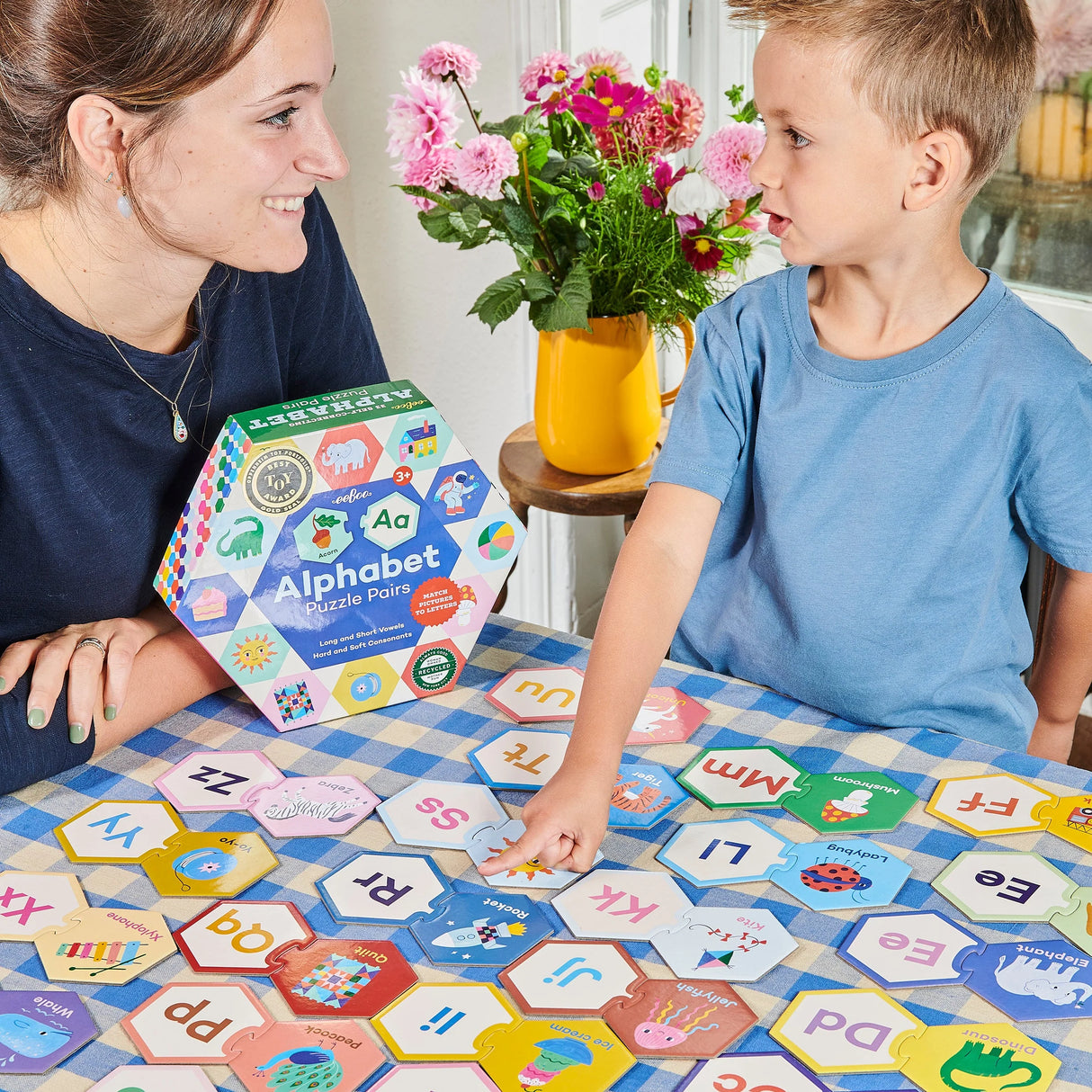 Alphabet Puzzle Pairs with colorful hexagon pieces helps children build pre-literacy and phonological awareness skills.