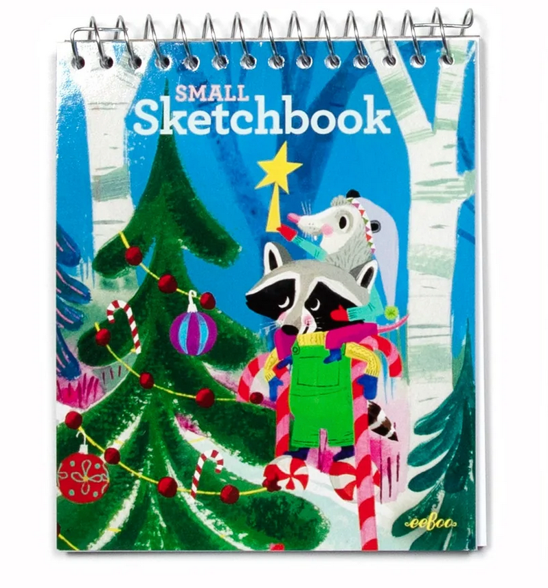 Small Sketchbook | Winter with illustrated raccoon and mouse decorating a Christmas tree in a snowy forest setting.