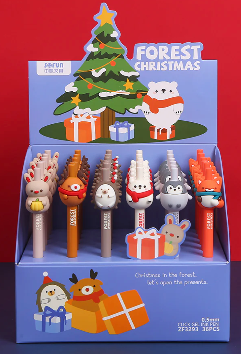 Forest Christmas Animal Gel Pen set displaying festive animal designs with Christmas tree and presents in the background.