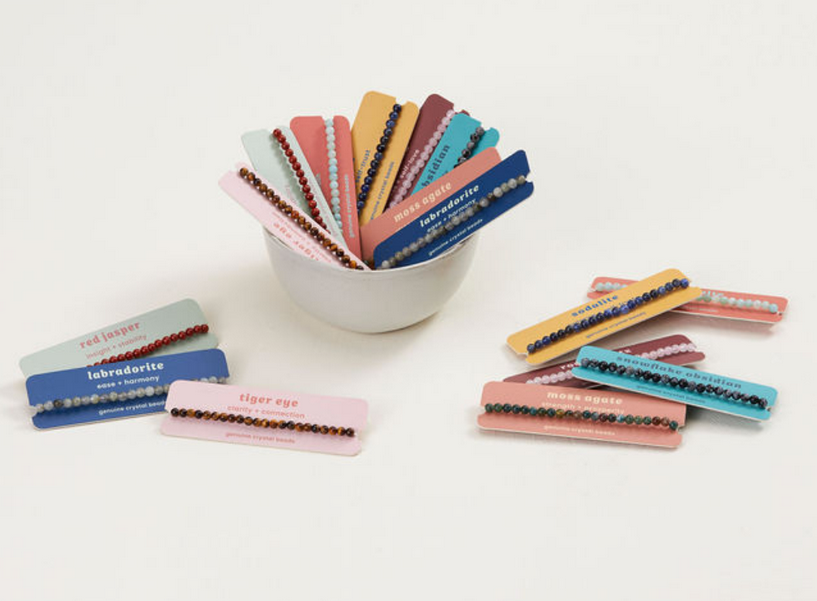 Mini Crystal Bracelet assortment with colorful 4mm genuine crystal beads on elastic cords, displayed on labeled cards.