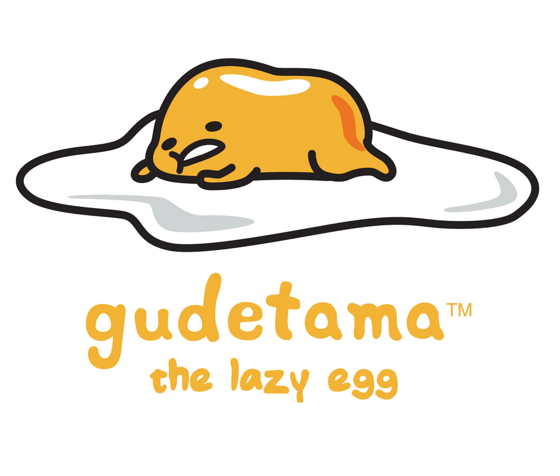 Shakipiyo plush is a soft, yellow chick with orange beak and feet wearing cracked eggshell pants.