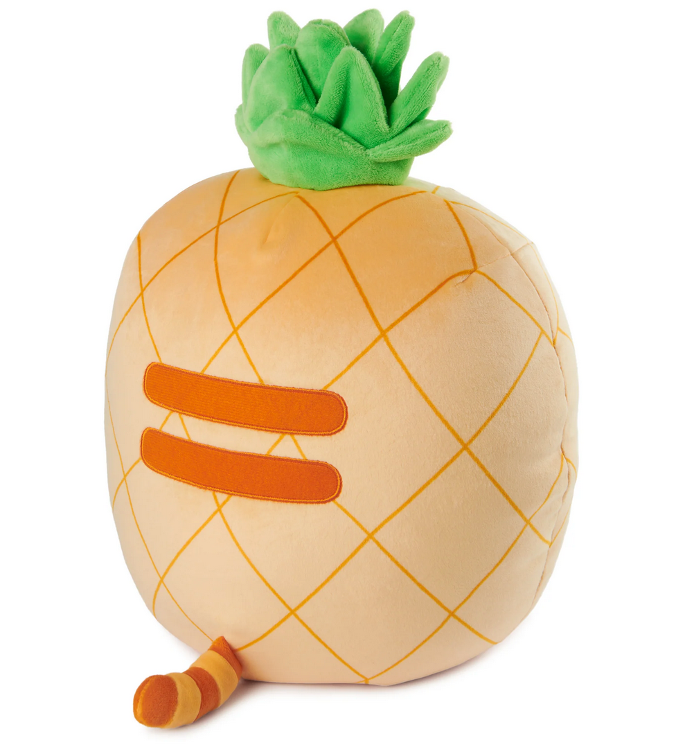 Pusheen Pineapple plush shows a soft pineapple-shaped tabby with green leaves and orange stripes.