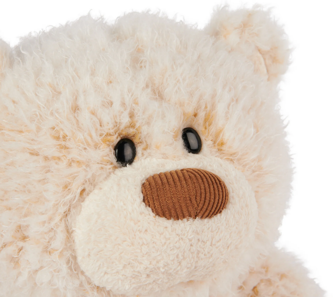 Teddy Bear Bubbles close-up showing super-soft curly cream plush and hazelnut-brown corduroy nose with charming expression.