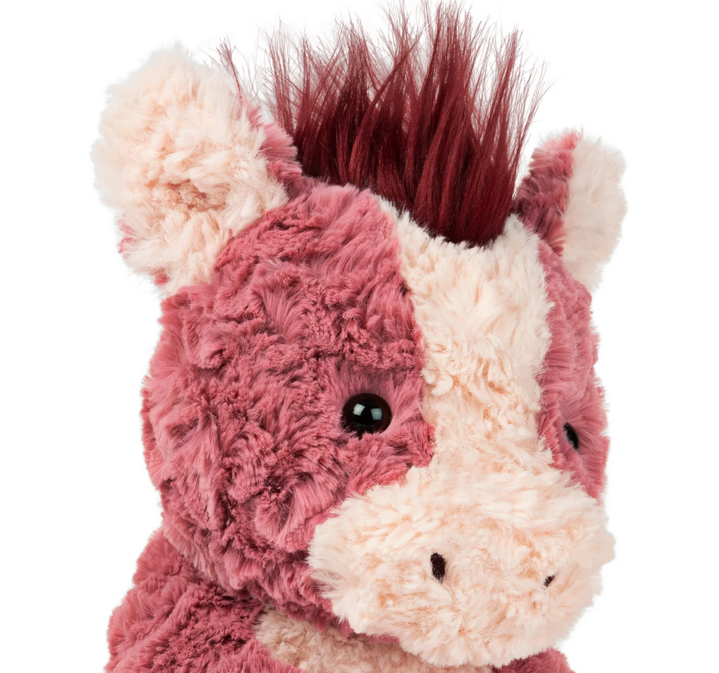 Cozys Horse plush with textured pink and red fur, floppy limbs, and silky mane, perfect for cuddling and play.