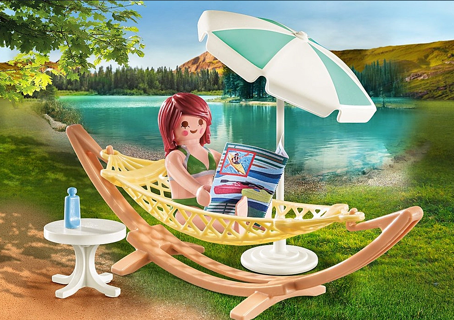 Family Fun | Hammock with PLAYMOBIL figure relaxing in hammock by lake with umbrella and table outdoors.