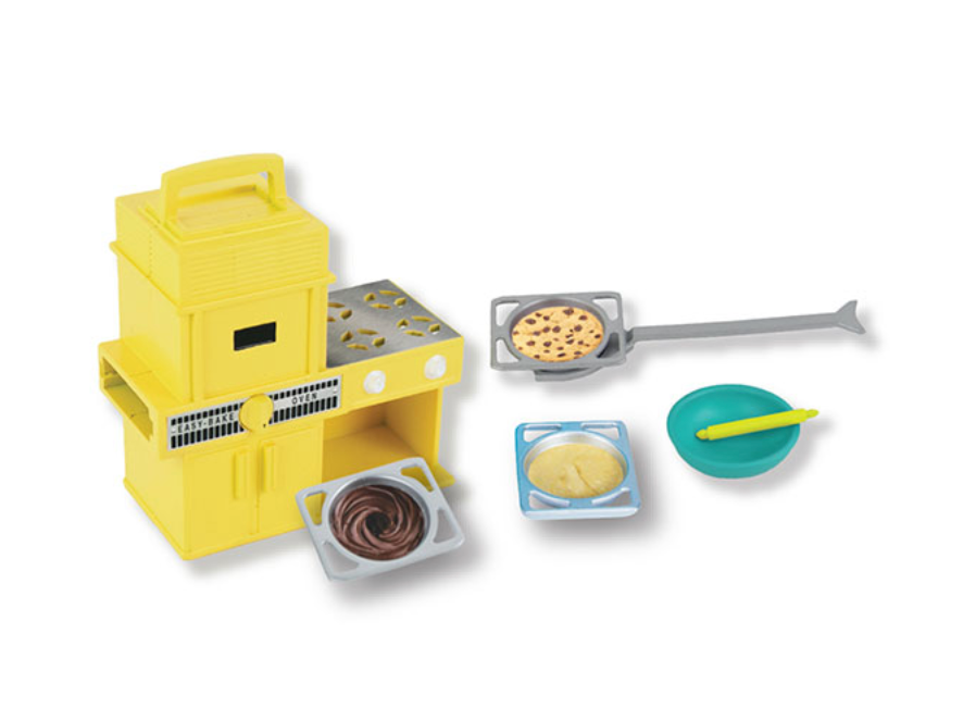 World's Smallest Easy Bake Oven with yellow toy oven, pans with pretend batter, spatula, and mixing bowl for pretend play.