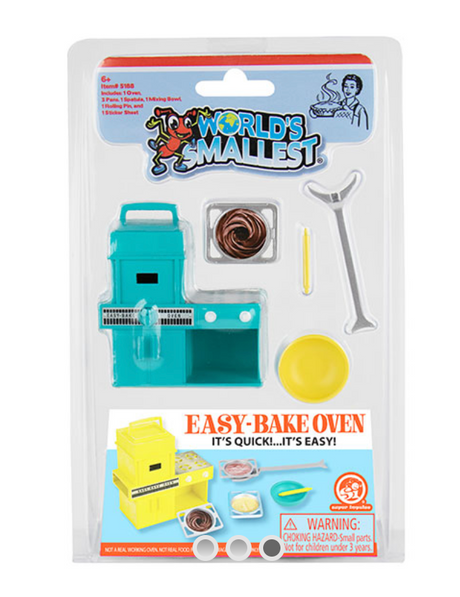 World's Smallest Easy Bake Oven toy set with miniature oven, pans, spatula, mixing bowl, and rolling pin in packaging