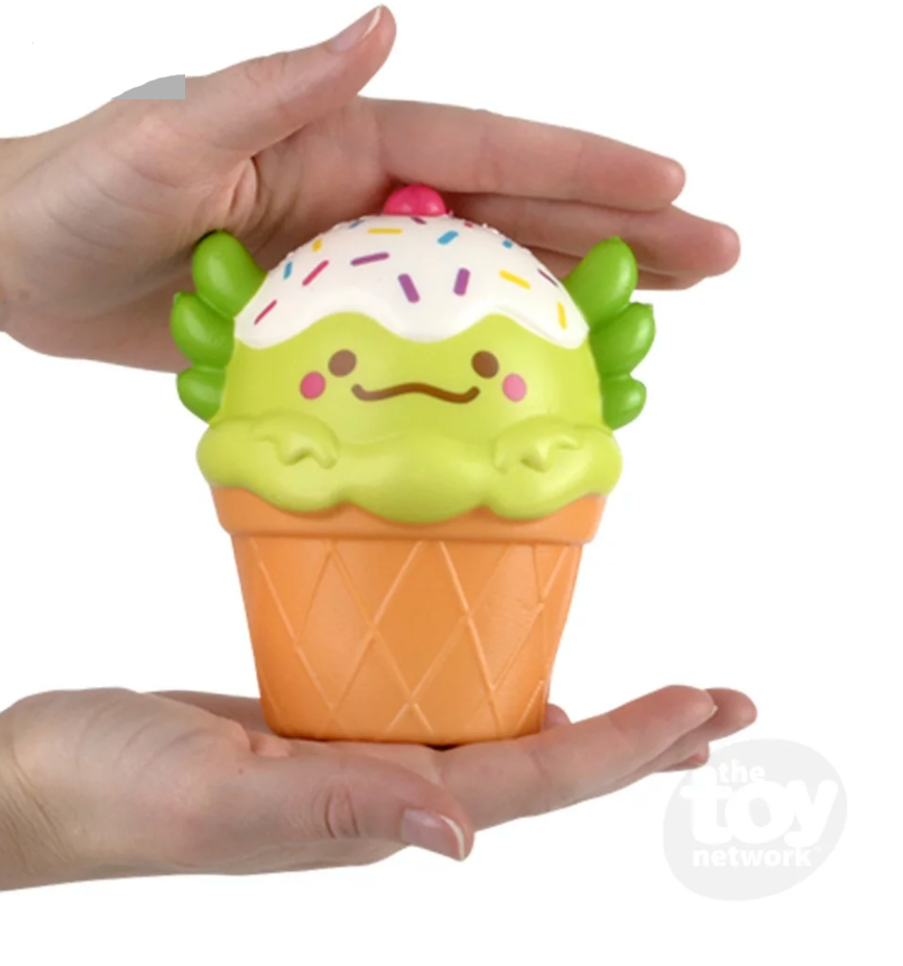 Hands holding a 5" Squishy Axolotl Foodie Friend soft foam ice cream cone with axolotl head and sprinkles.