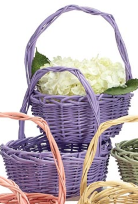 Spring Color Willow Basket Purple with overhead handle holding white flowers, round and oval shape baskets displayed together.