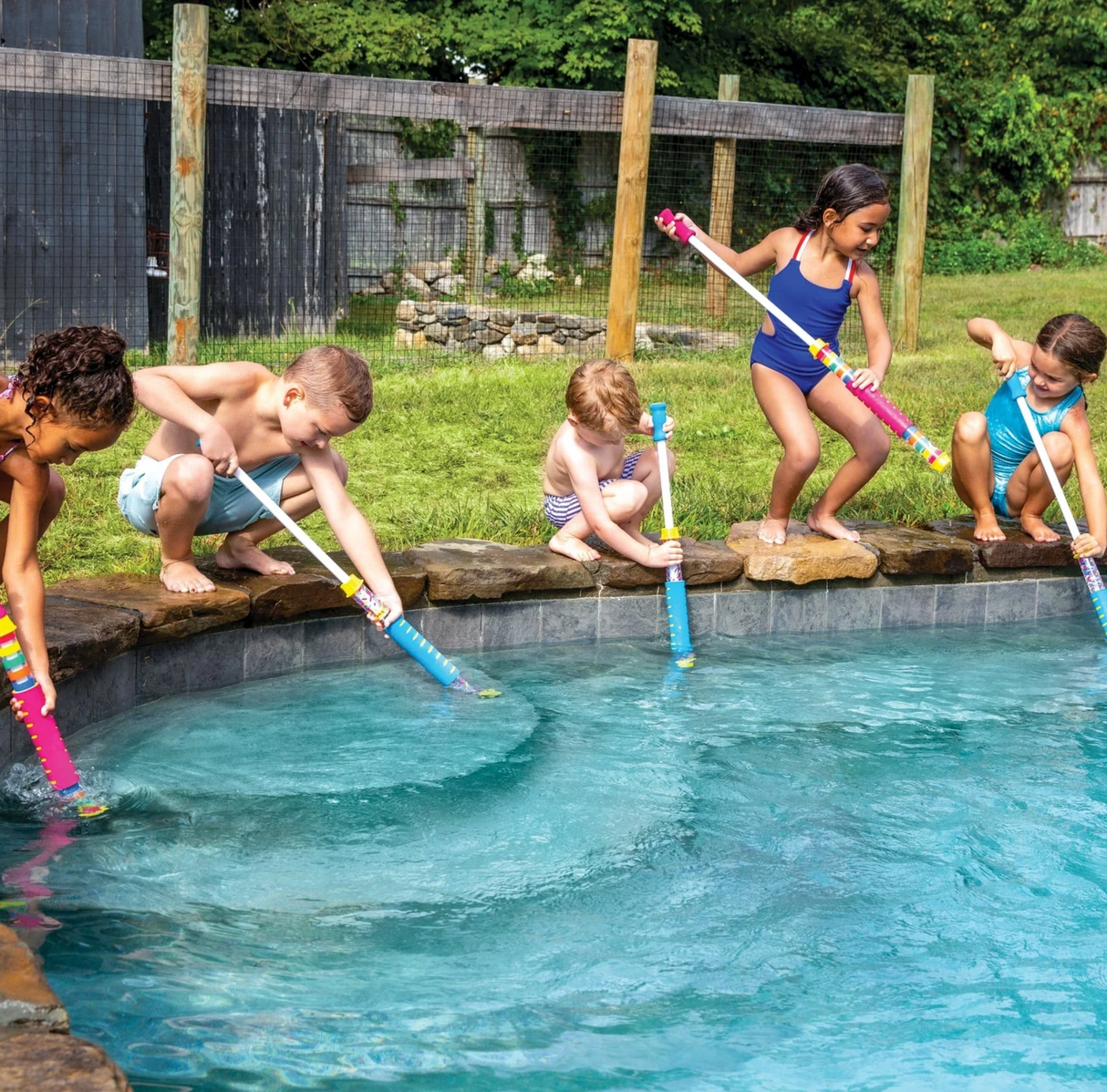 Kids playing and soaking friends with Water Cannon | Blue by the pool on a sunny day.
