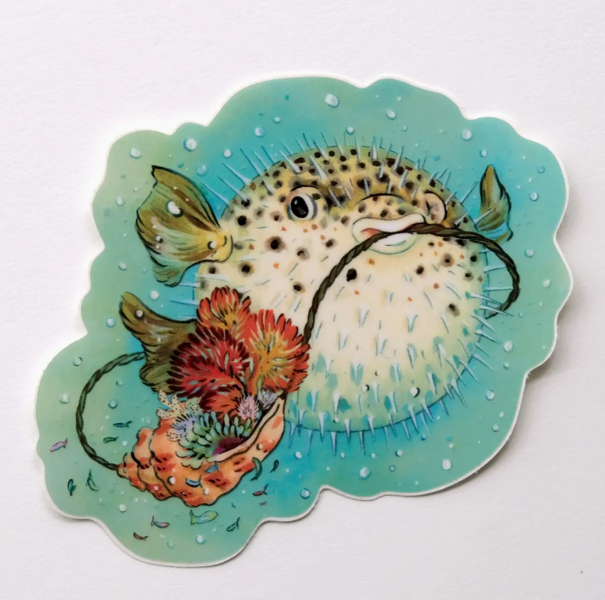 Pufferfish Sticker featuring a detailed pufferfish with coral and sea-shell on clear blue background vinyl.