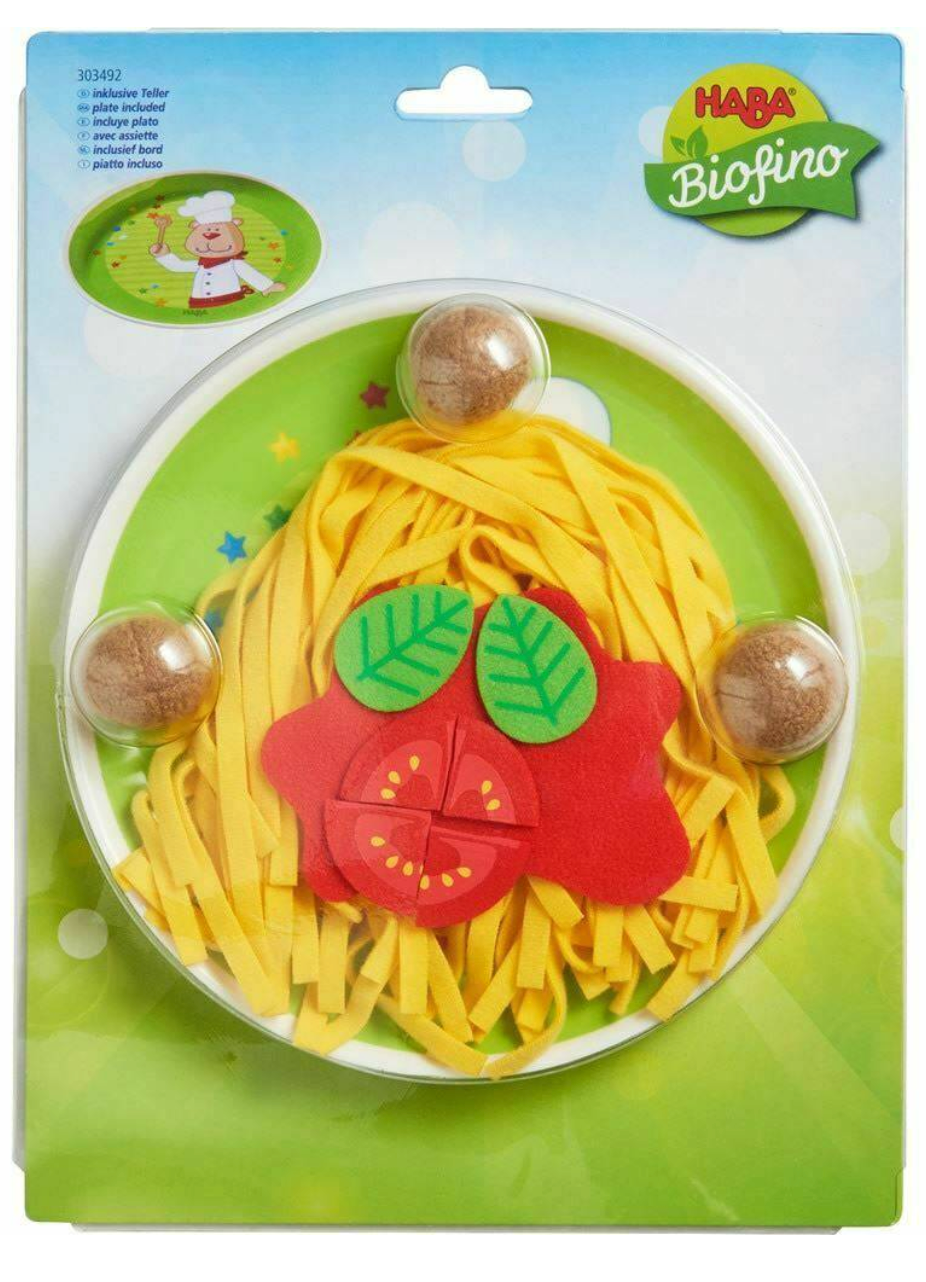 Spaghetti Bolognese play food set with noodles, meatballs, tomato wedges, and basil leaves on a play plate.