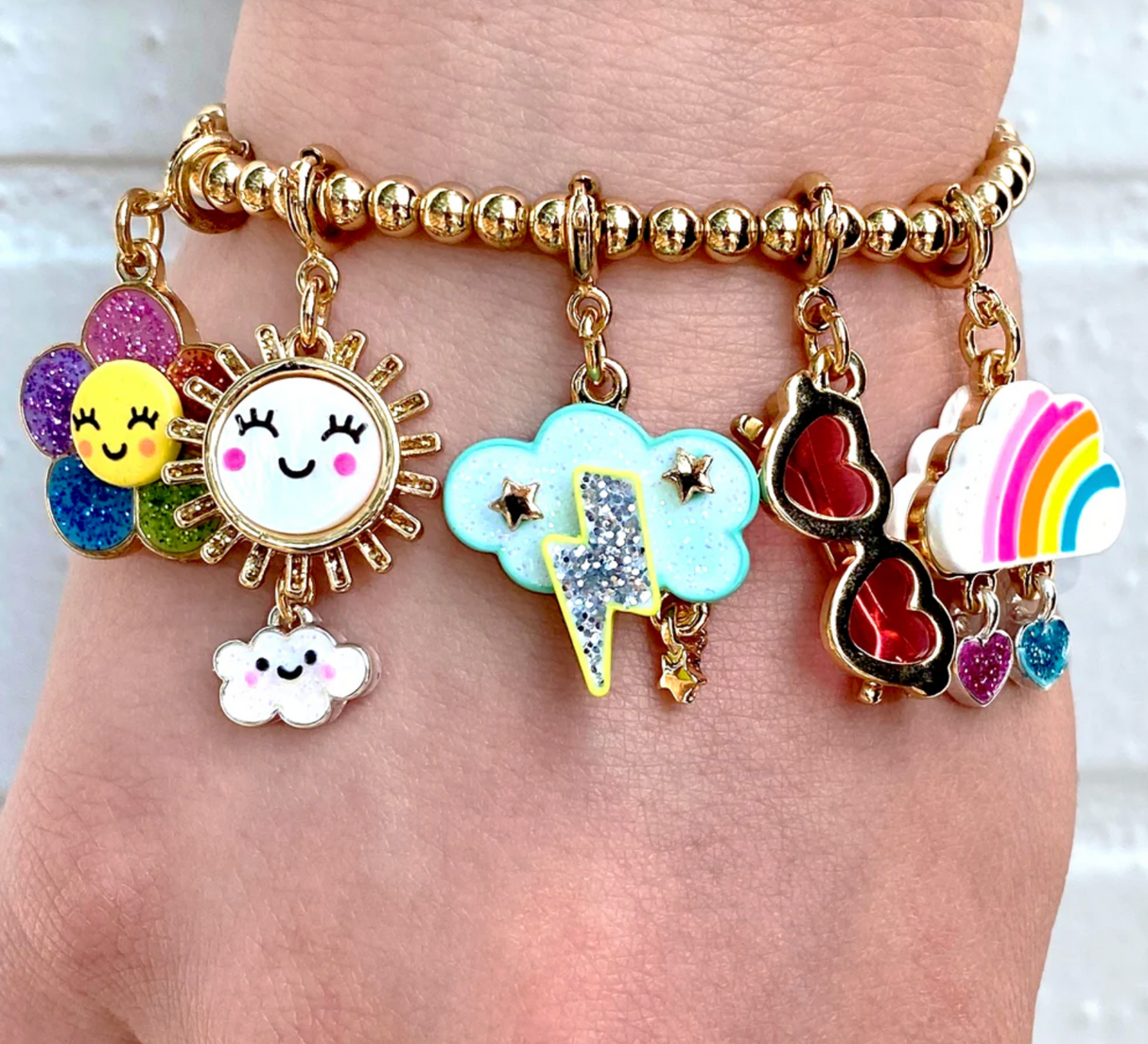 Gold Glitter Lightning Charm on a gold beaded bracelet with colorful weather-themed charms.