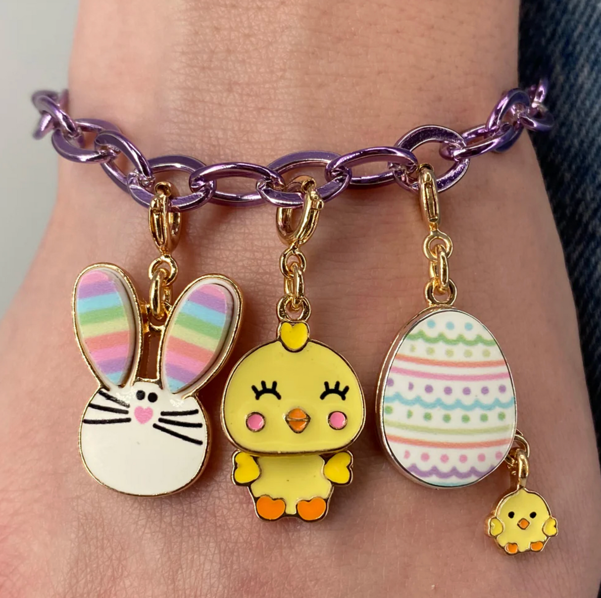 Gold Swivel Chick Charm featuring a cute yellow chick on a purple chain bracelet with other pastel charms.