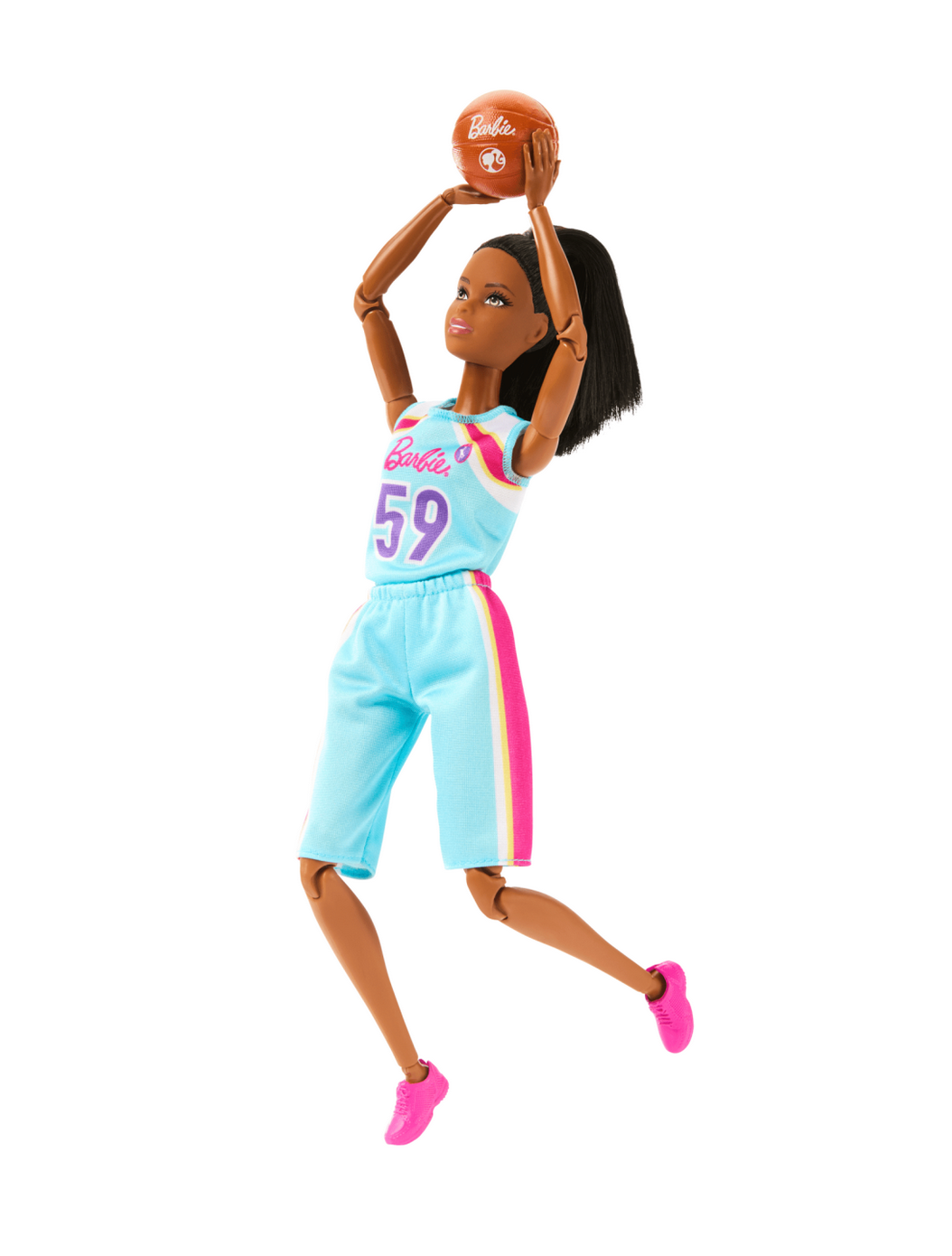 Barbie Made to Move Basketball doll in colorful uniform shooting a basketball with flexible joints for dynamic play.