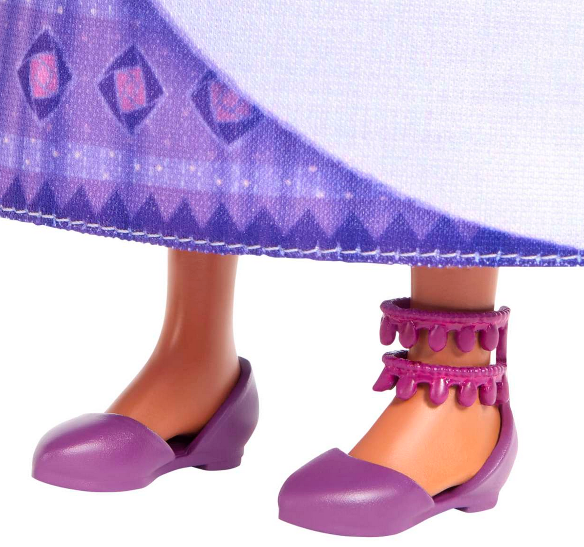 Disney Wish Asha doll feet wearing purple shoes and ankle accessories with detailed patterned dress hem.