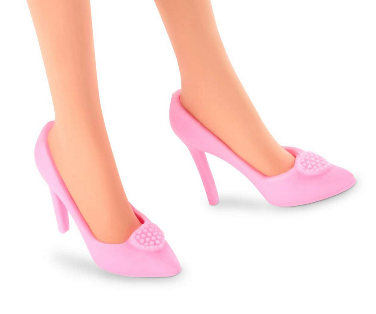 Pink high-heeled shoes worn by Barbie doll in Barbie The Movie, featuring a heart-shaped embellishment on each shoe.