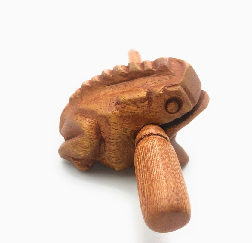 Wooden Croaking Frog | 1.5in Light Brown percussion toy from wood with striker that creates ribbit sound when rubbed.