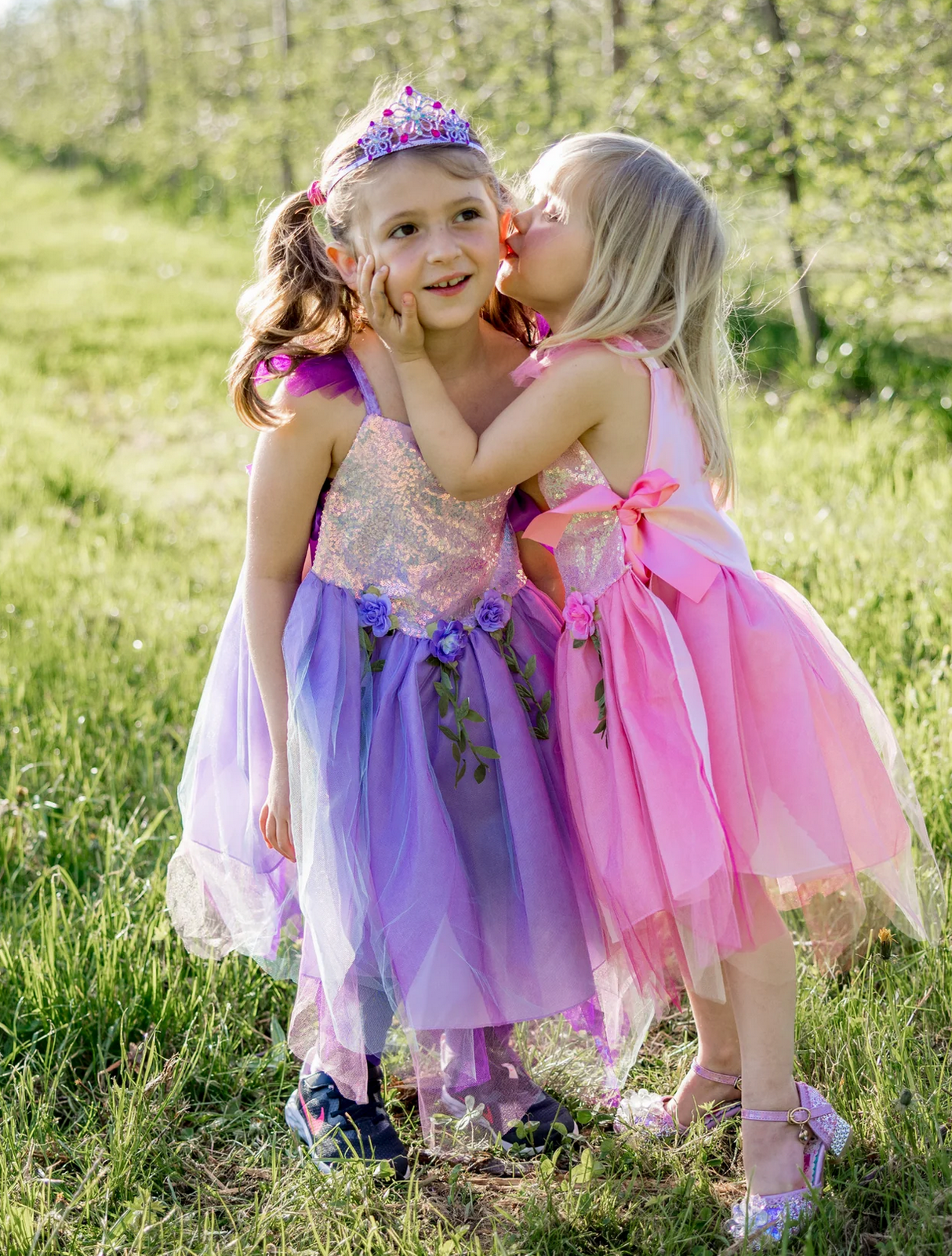 Pink Sequins Fairy Tunic | Size 3-4 on a child outdoors with a pink bow and shimmering sequins in a sunny field.