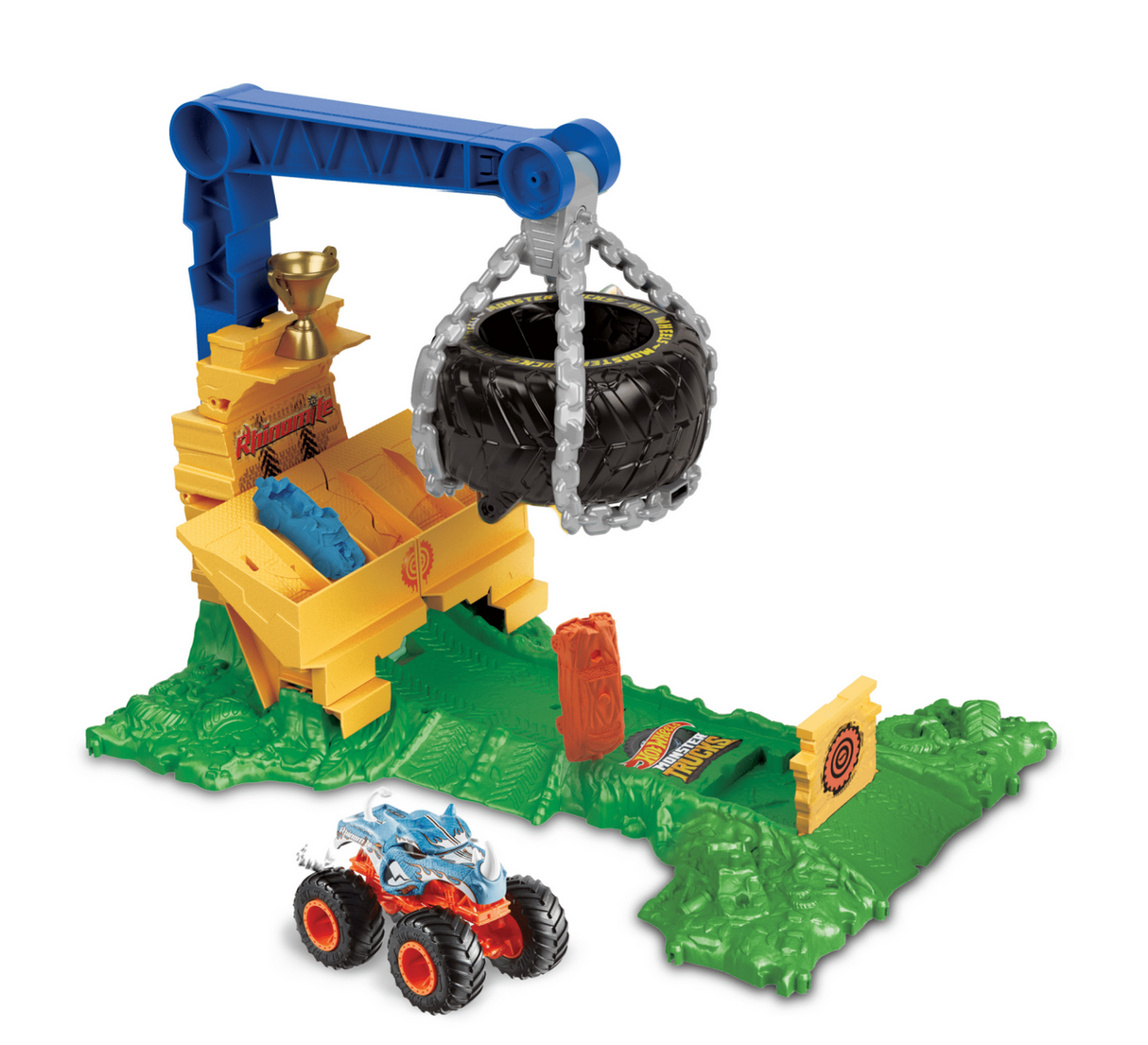 Hot Wheels Monster Trucks Rhinomite Chargin Challenge playset with suspended tire trap and 1:64 scale Rhinomite truck on green terrain.