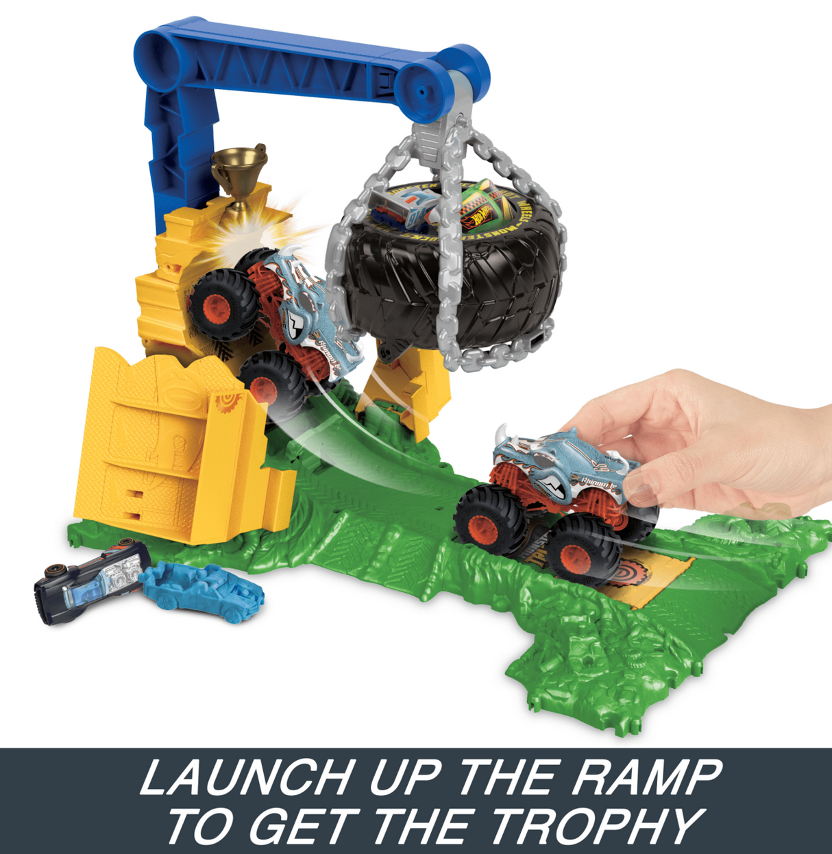Hot Wheels Monster Trucks Rhinomite Chargin Challenge playset with ramp, tire trap, and monster truck action.