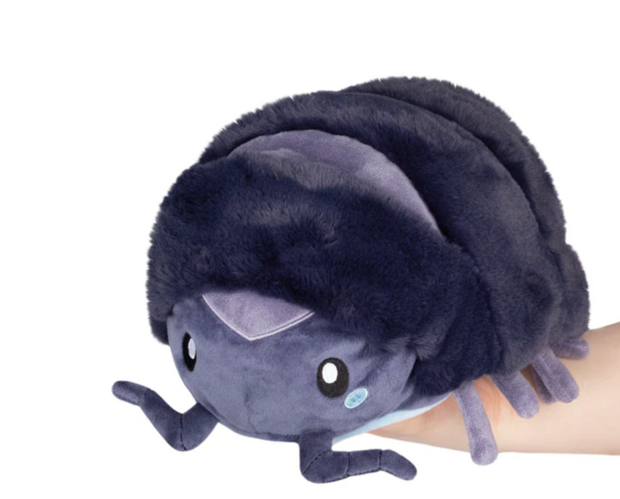 Pillbug Mini plush toy shown in hand, soft purple chitinous invertebrate that rolls into a ball with magnets.