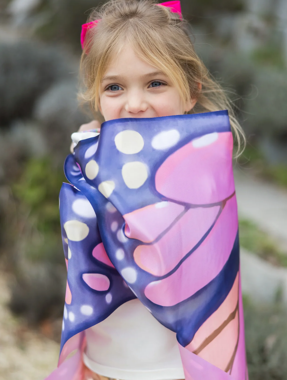 Young girl wrapped in Soft Wings | Mystical Monarch featuring vibrant, hand-drawn monarch butterfly patterns and delicate design.