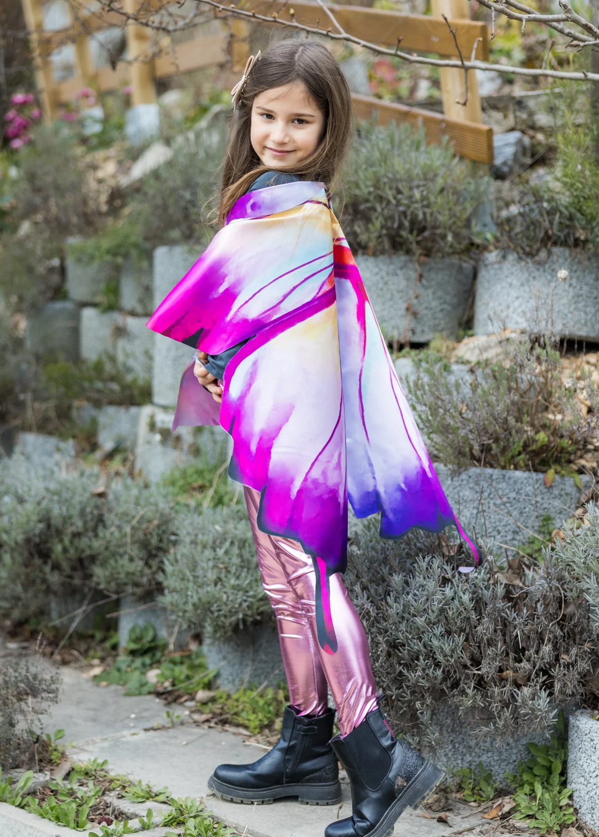 Young girl wearing Soft Wings | Ombre Butterfly with vibrant purple and white ombre butterfly wing cape outdoors