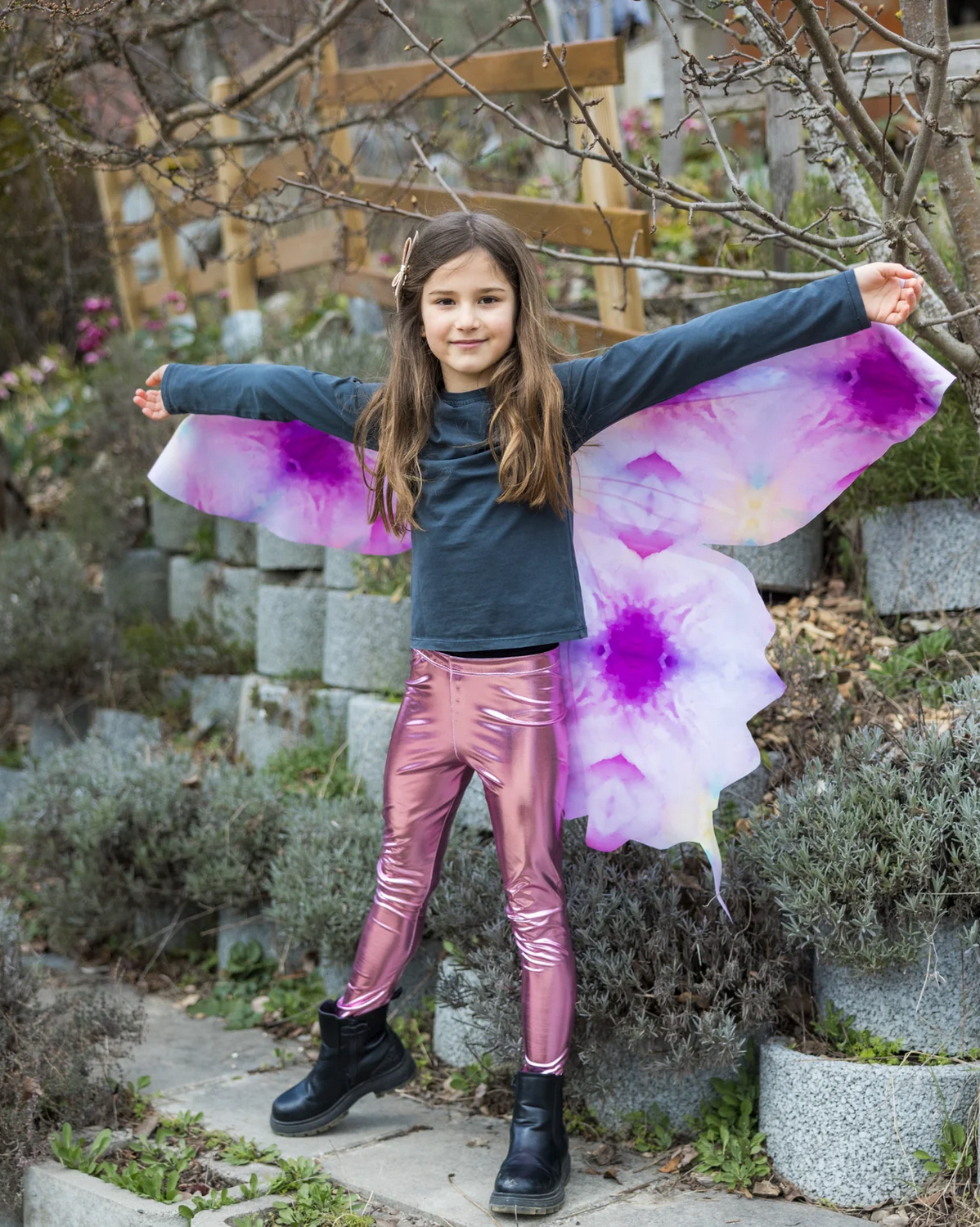Young girl outdoors wearing Soft Wings | Ombre Butterfly with purple and pink gradient wings and casual outfit.