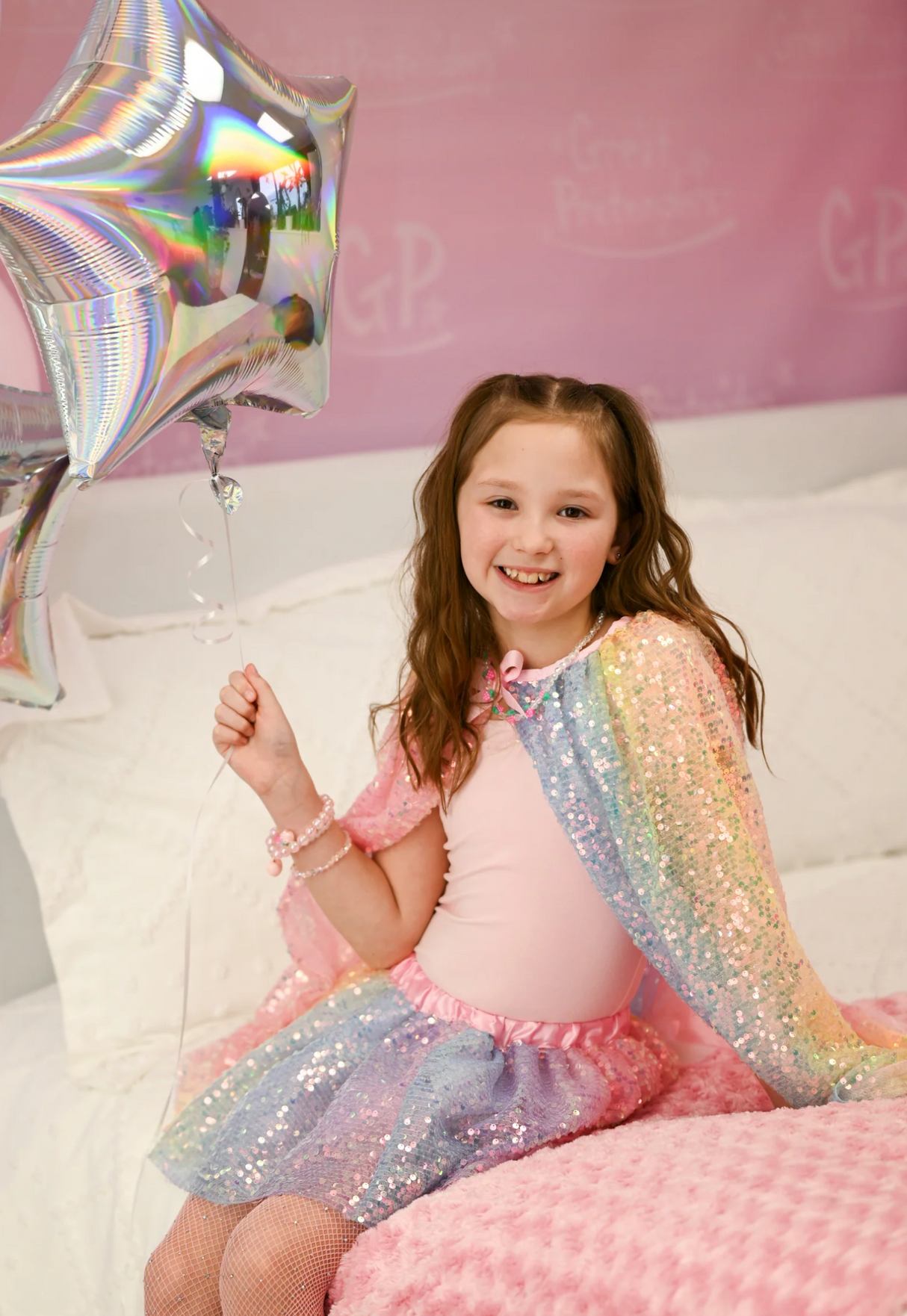 Sequins Cape | Ombre Size 4-6 worn by girl holding star balloons with shimmering sequins in pastel ombre colors