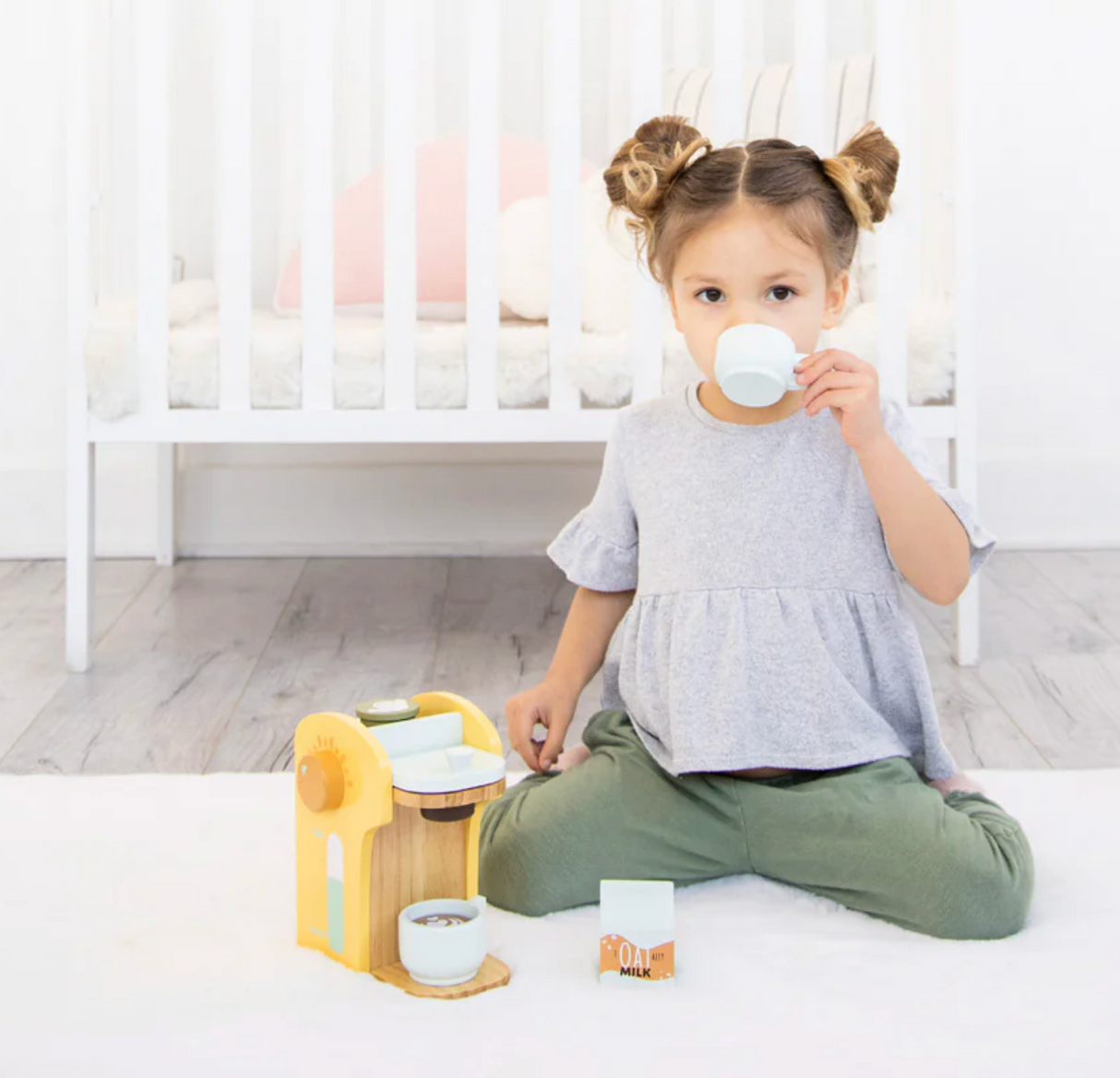 Child playing with Barista in Training Wooden Coffee Set, engaging in imaginative coffee play with wooden accessories.