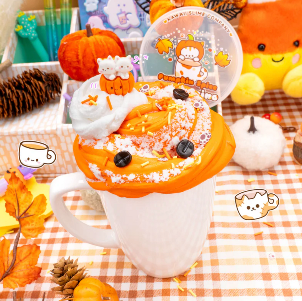 Pumpkin Spice Catpuccino Butter Slime with creamy foam and cat drizzles in a white mug on a fall-themed table.