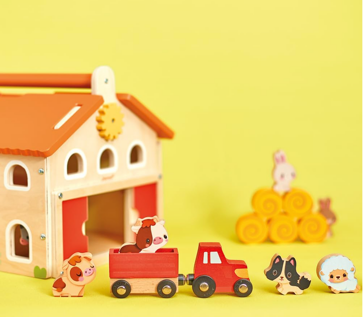 Farm My First Farm Set wooden farmhouse toy with tractor, animals, hay bales, and interactive play features on yellow background.