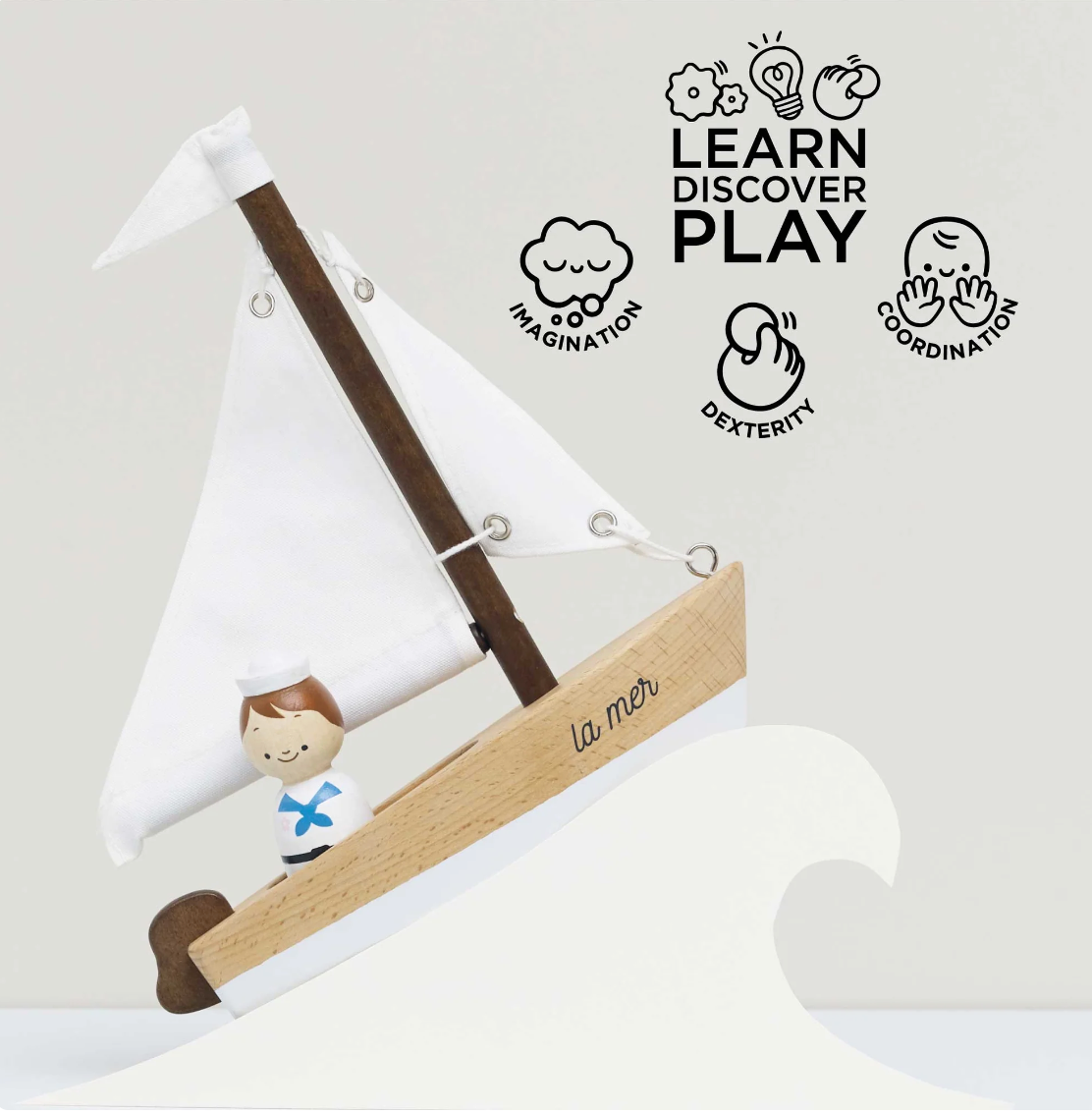 Sail Boat & Captain wooden toy with cotton sails and a painted sailor figure promoting imaginative play for ages 2 and up.