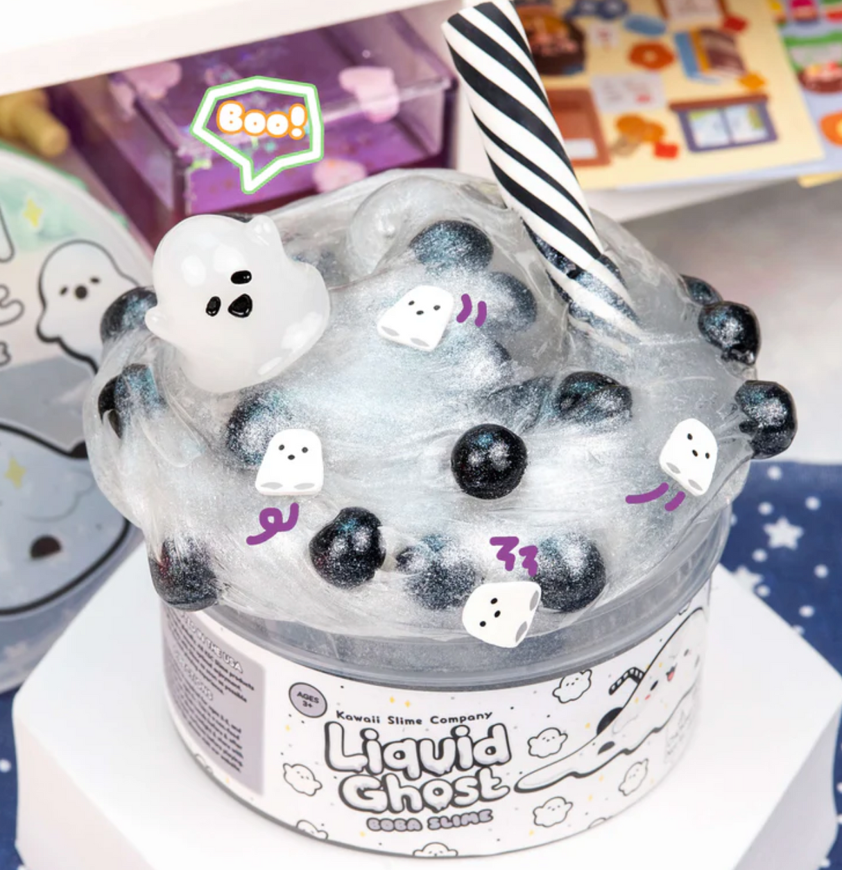 Liquid Ghost Boba Clear Slime with iridescent slime, black boba pearls, ghost charm, and striped pretend straw.