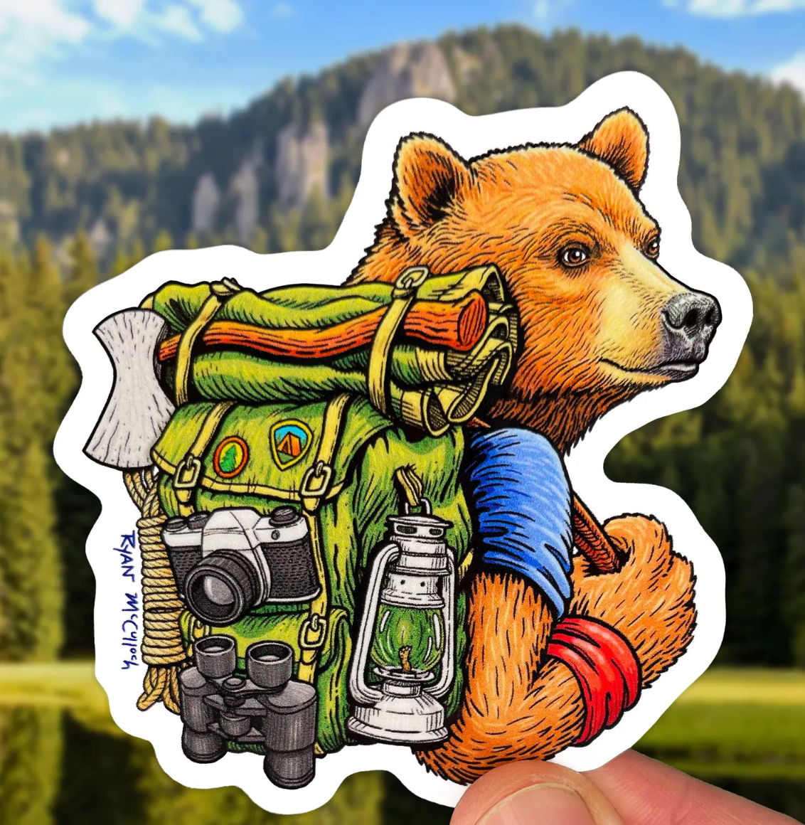 Hiking Bear Sticker showing a bear with hiking gear, backpack, and outdoor essentials against nature background.