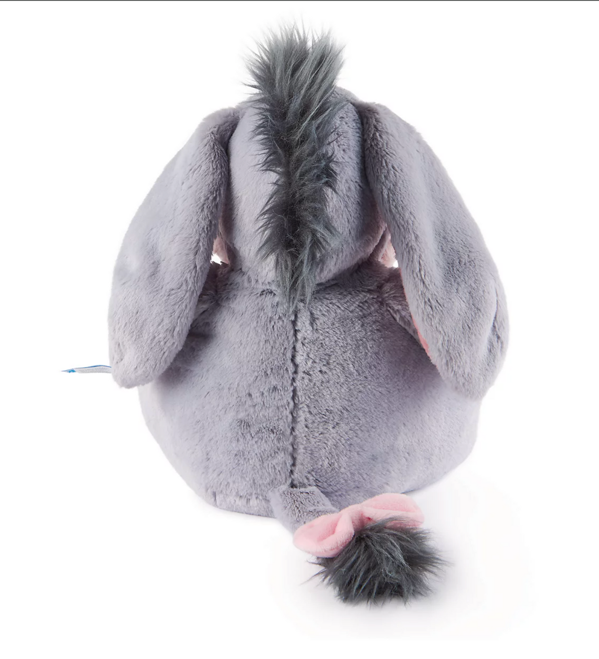 Oh So Snuggly Eeyore plush with soft gray fur, pink bow on tail, and long floppy ears, perfect for cuddling and play.