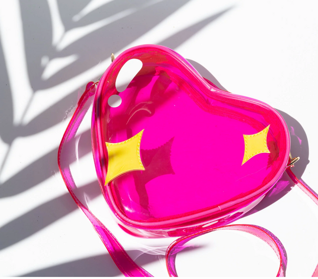 Handbag Jelly Sparkle Emoji in bright pink heart shape with yellow sparkle accents and adjustable strap on white background.