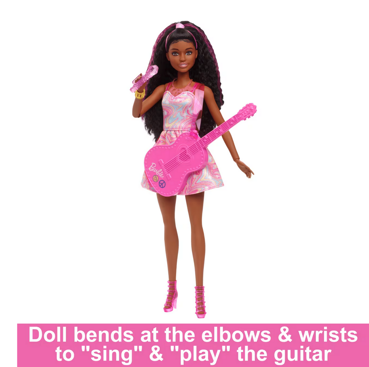 Barbie Pop Star Playset doll in pink outfit with guitar and microphone, posing to sing and play music.
