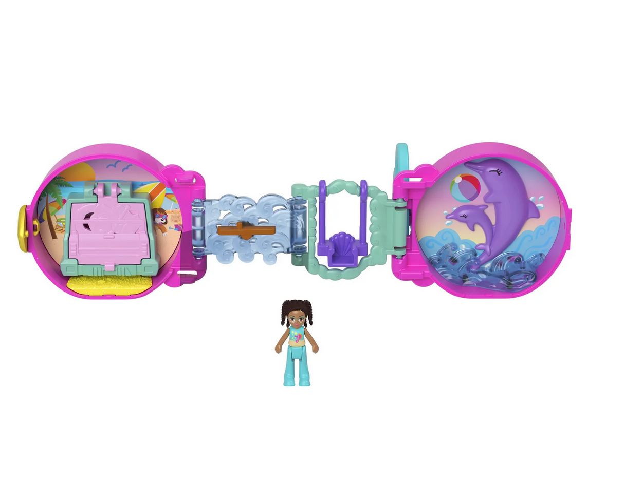 Polly Pocket On the Go Fun compact opened showing ocean theme playset with dolphin, swing, and included doll figure.