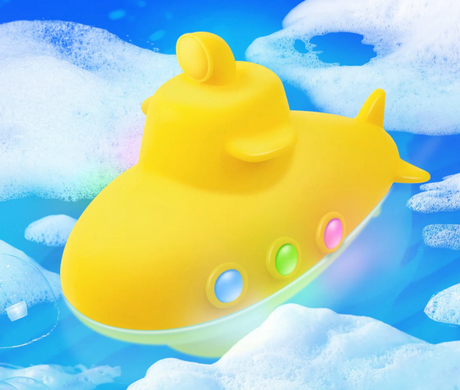 Yellow Tub Sub floating in bubbly water, lighting up with colorful LED lights for bath time fun.