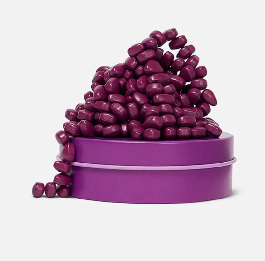 Speks. Matte. Mini Crags. Iris. shows purple magnetic putty beads on a small purple tin, perfect for on-the-go tactile fun.