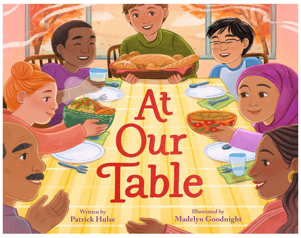 At Our Table shows a diverse group joyfully sharing food around a warm, inviting Thanksgiving table.