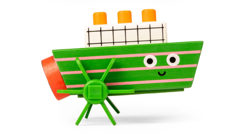 Kidoki Windup Boat wooden bath toy with green stripes, friendly face, and spinning propellers for kids ages 3 and up.