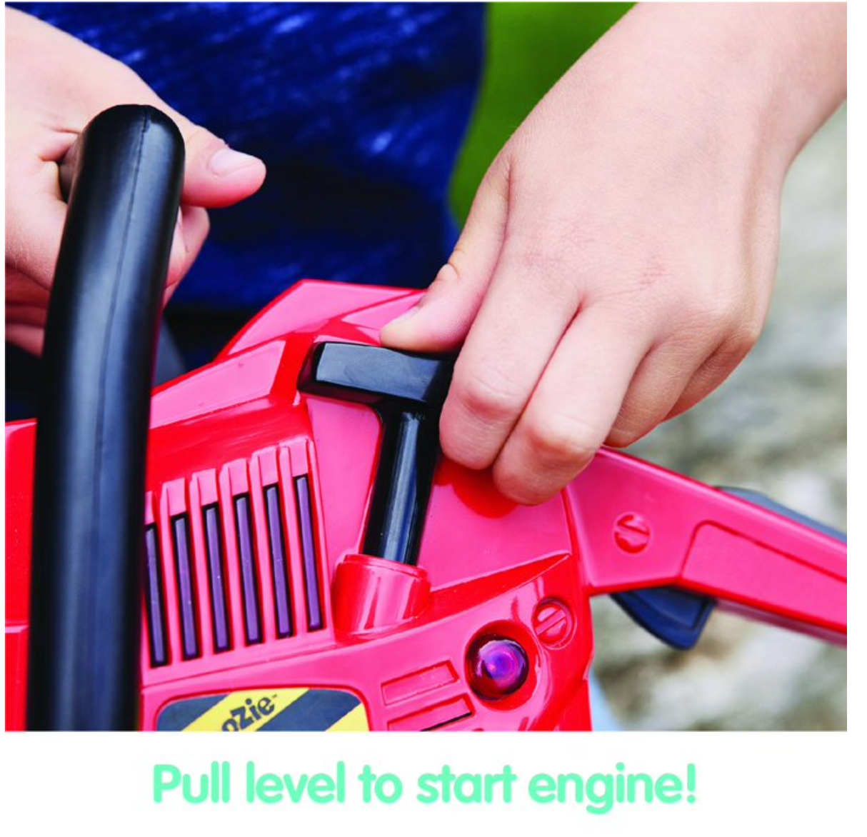 Close-up of child’s hands pulling starter handle on the Power Chainsaw toy with realistic sound and light features.