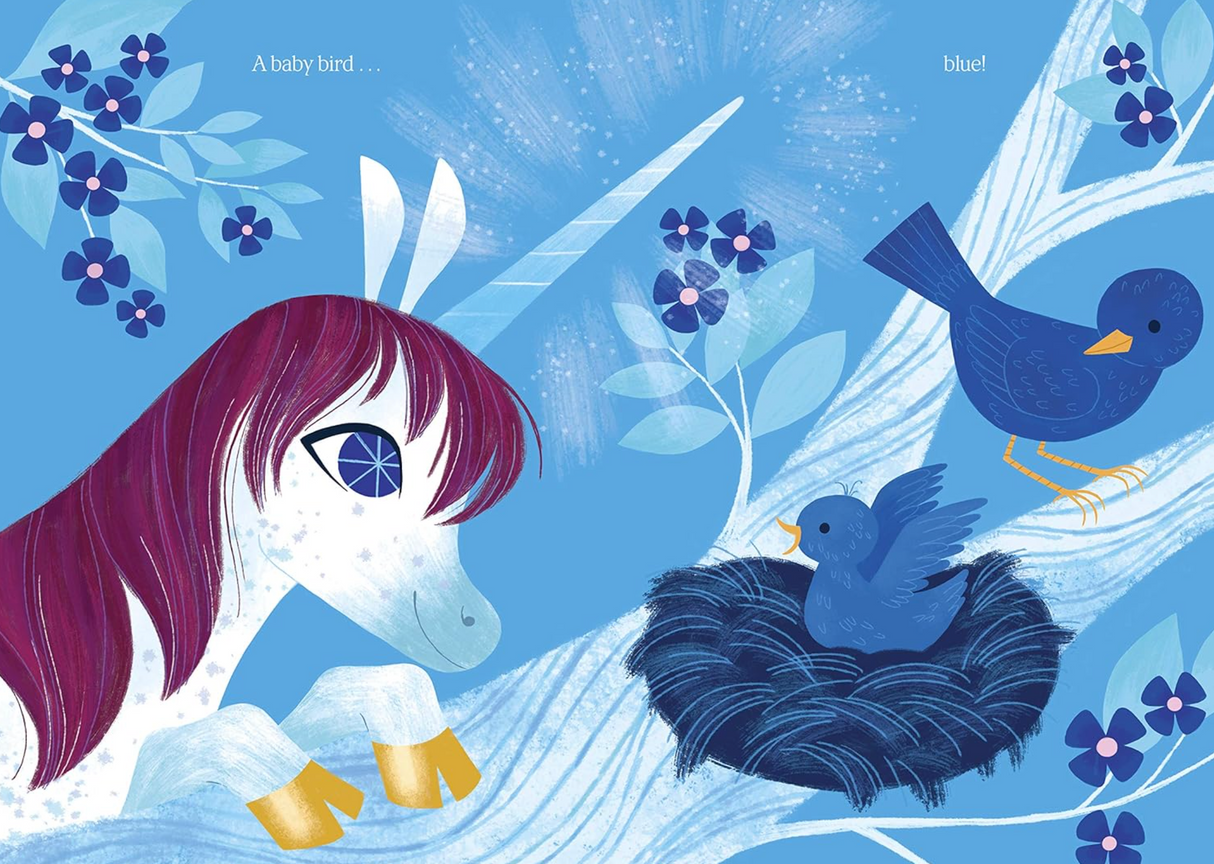 Uni Paints a Rainbow shows Uni the Unicorn marveling at a baby blue bird in a vibrant blue nature scene.