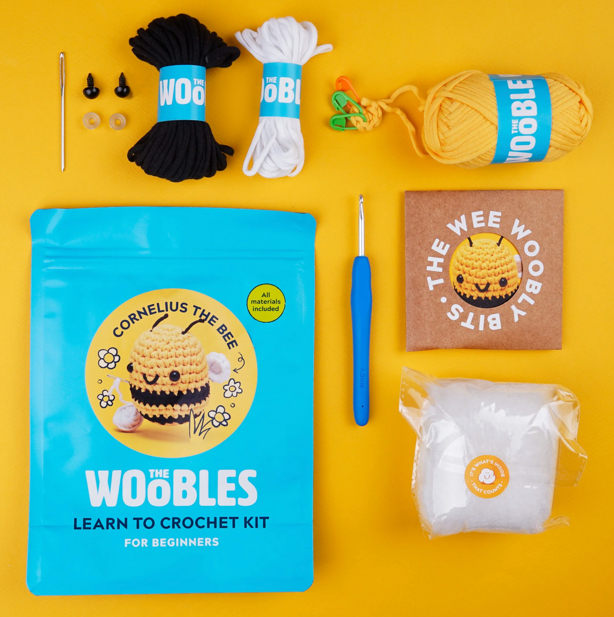 Woobles Crochet Kit | Cornelius the Bee with yarn, crochet hook, stuffing, eyes, needle, and pattern for beginners.
