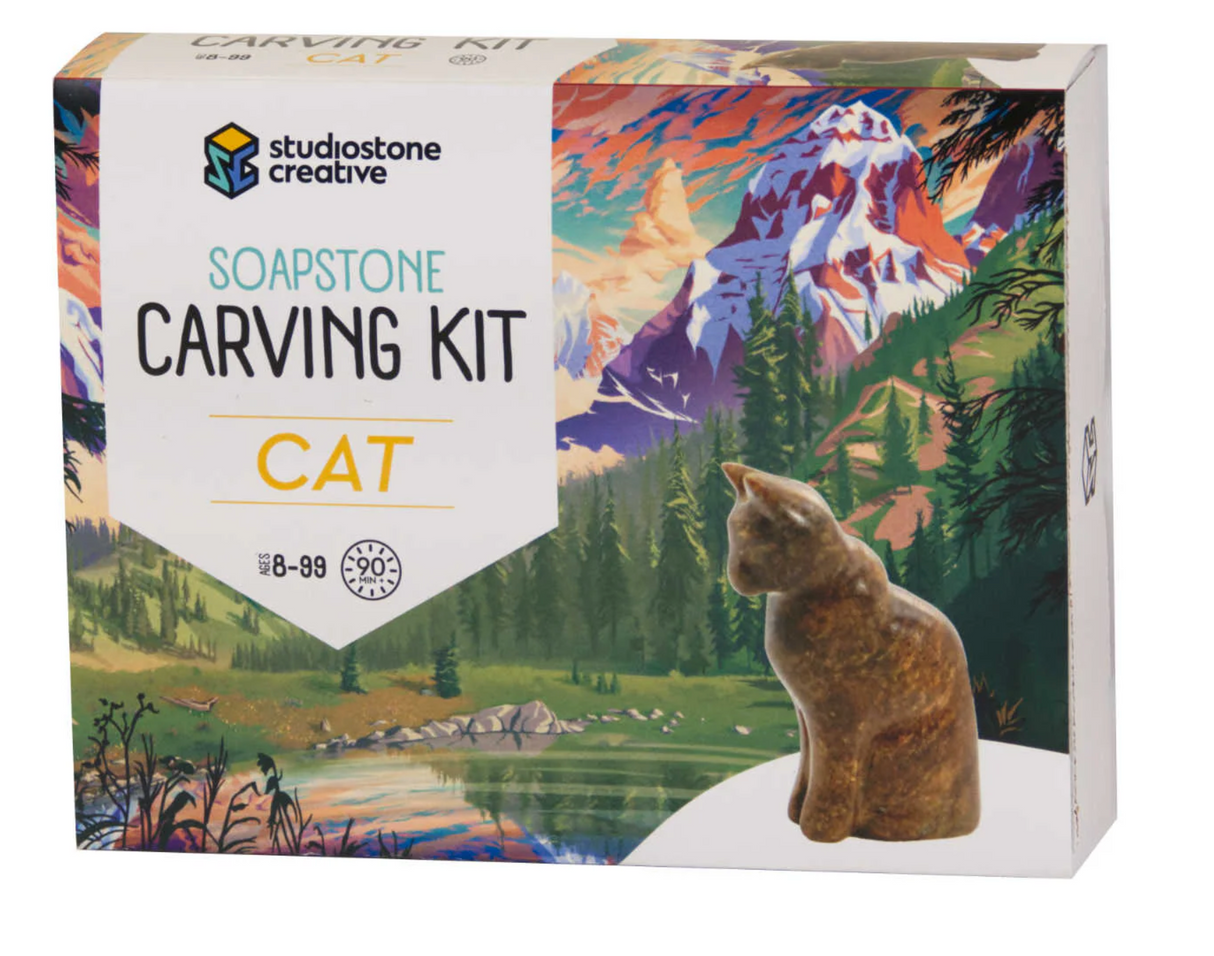 Soapstone Carving Kit | Cat featuring a natural soapstone cat sculpture with eco-friendly packaging and scenic mountain artwork.