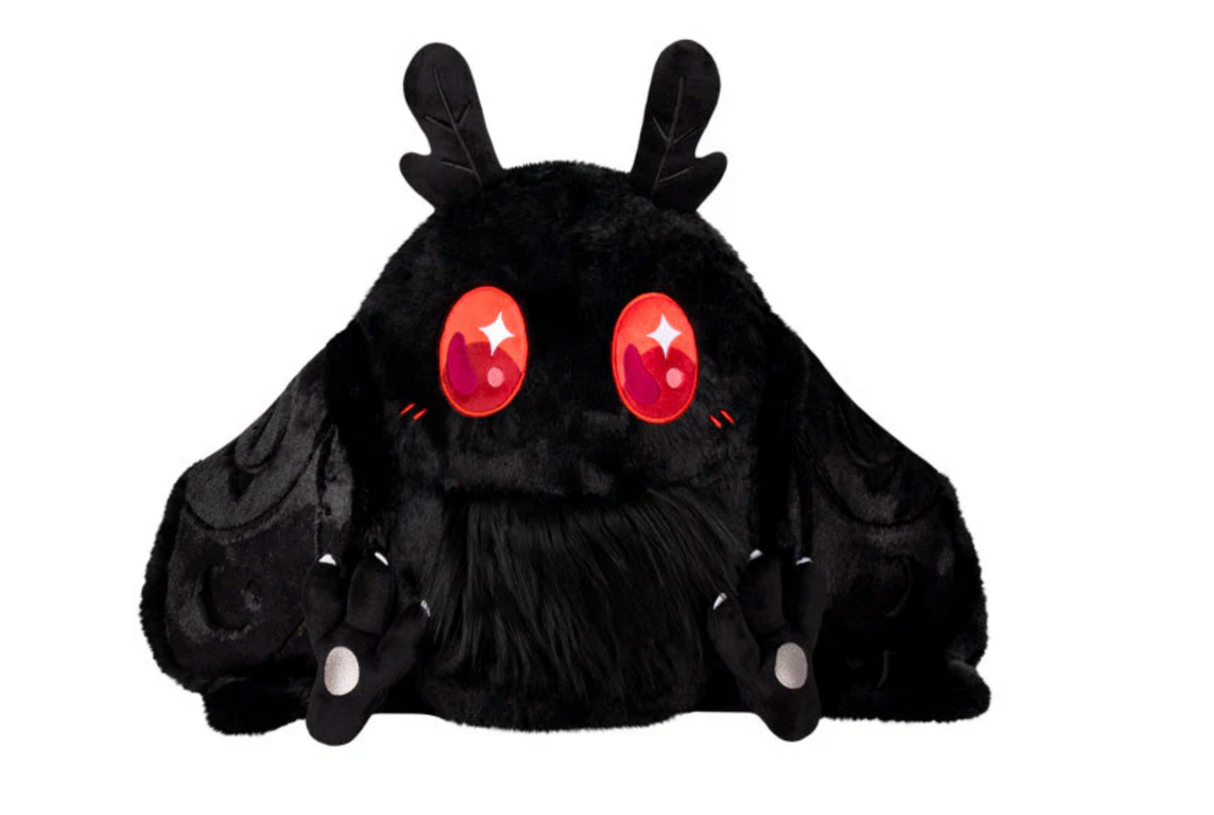Baby Mothman Snackers plush toy with jet-black fur, floppy wings, and bright red eyes, perfect for all ages.