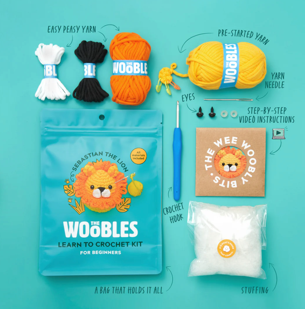 The Woobles Crochet Kit | Sebastian the Lion with yarn, crochet hook, stuffing, eyes, and step-by-step video instructions.